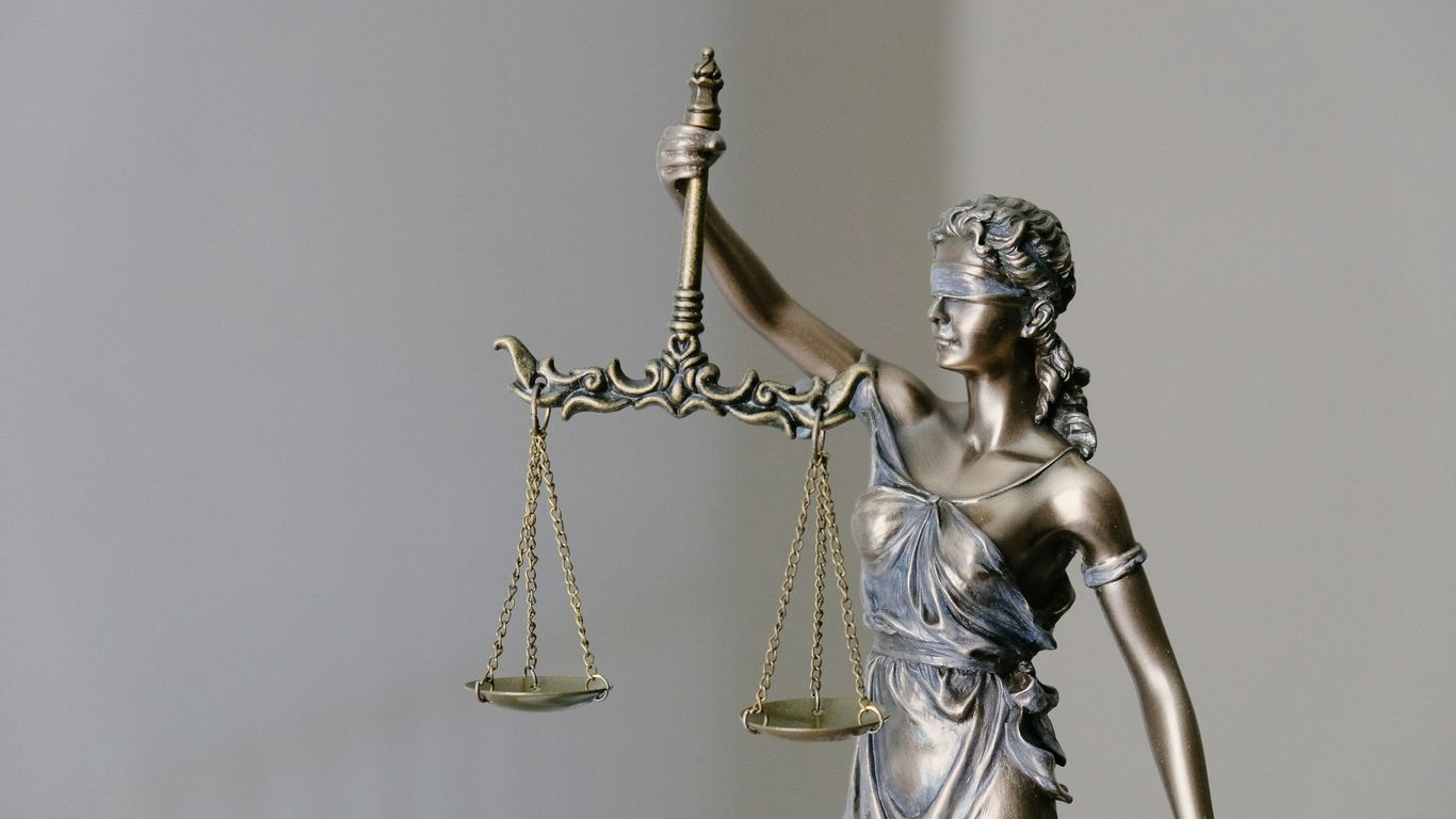 lady justice statue with scales and sword