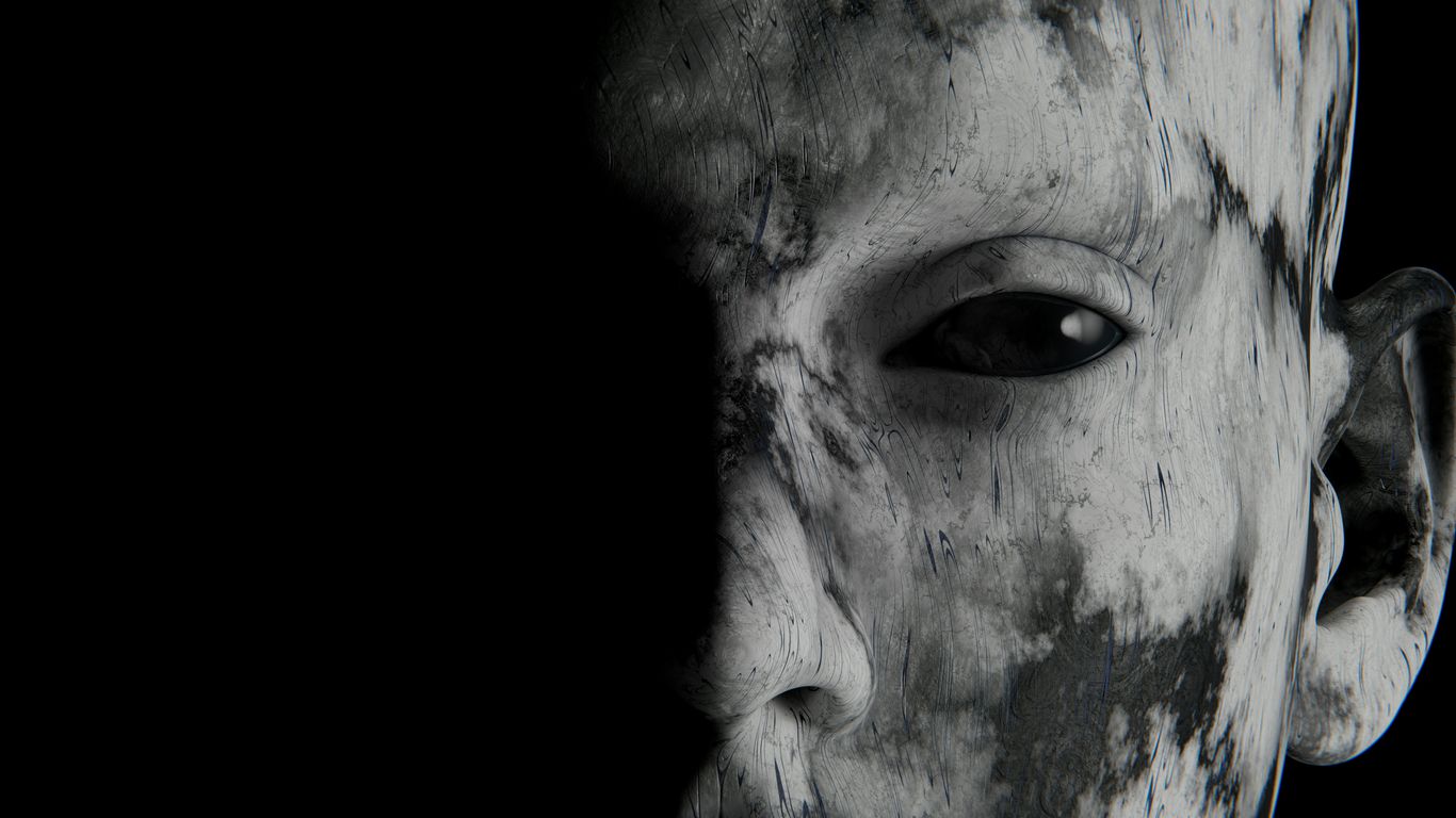 A spooky face peeks from the darkness.