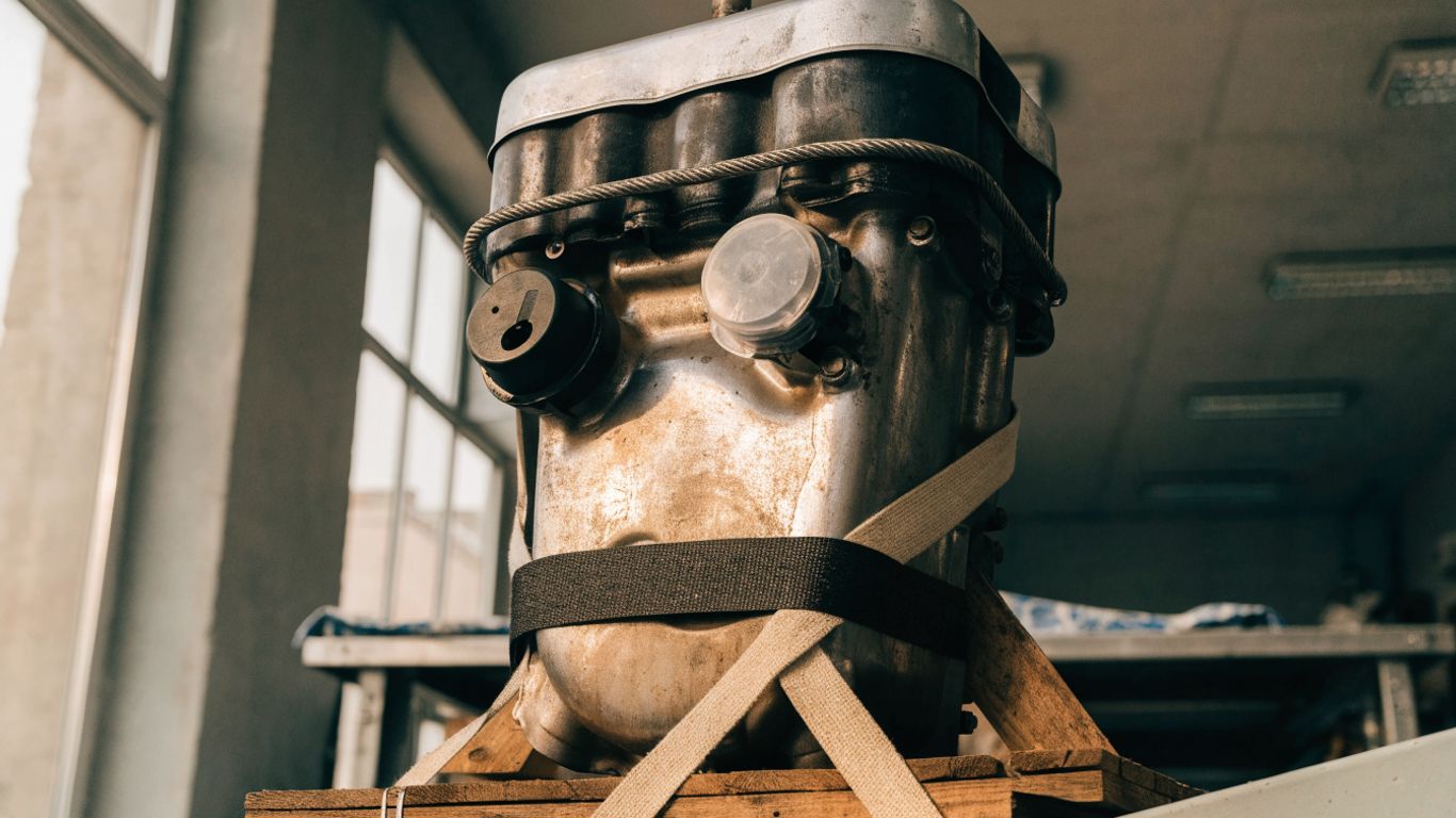 A drained engine secured on a sturdy pallet