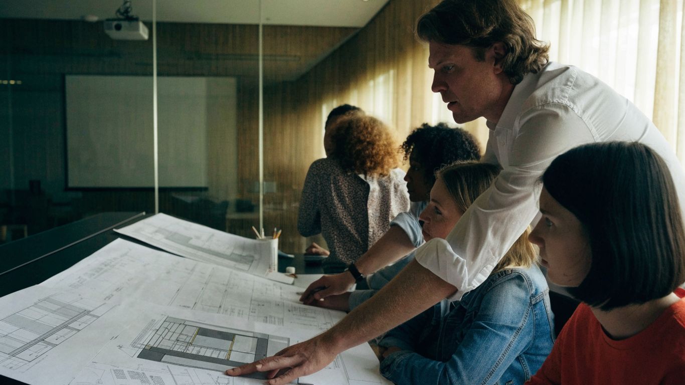 Project team coordinating structural drawings and design criteria