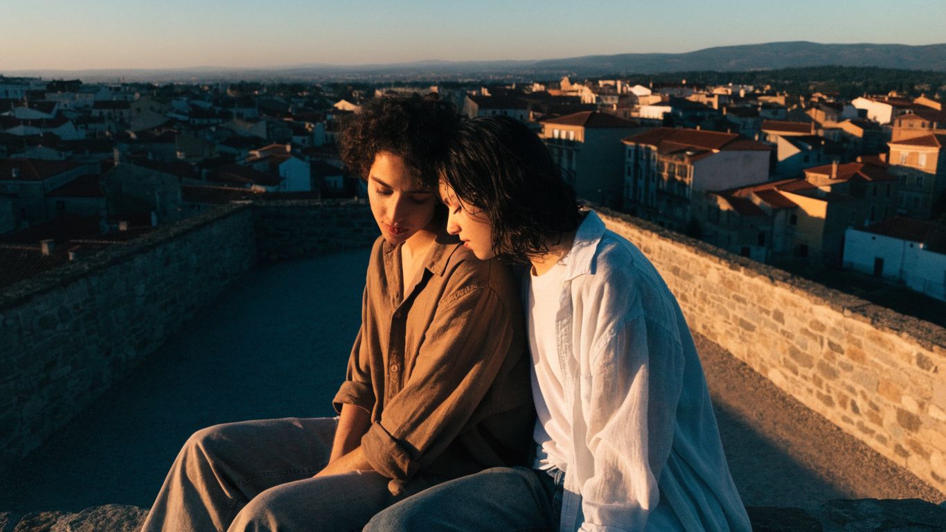Couple sharing a quiet sunset in a European city