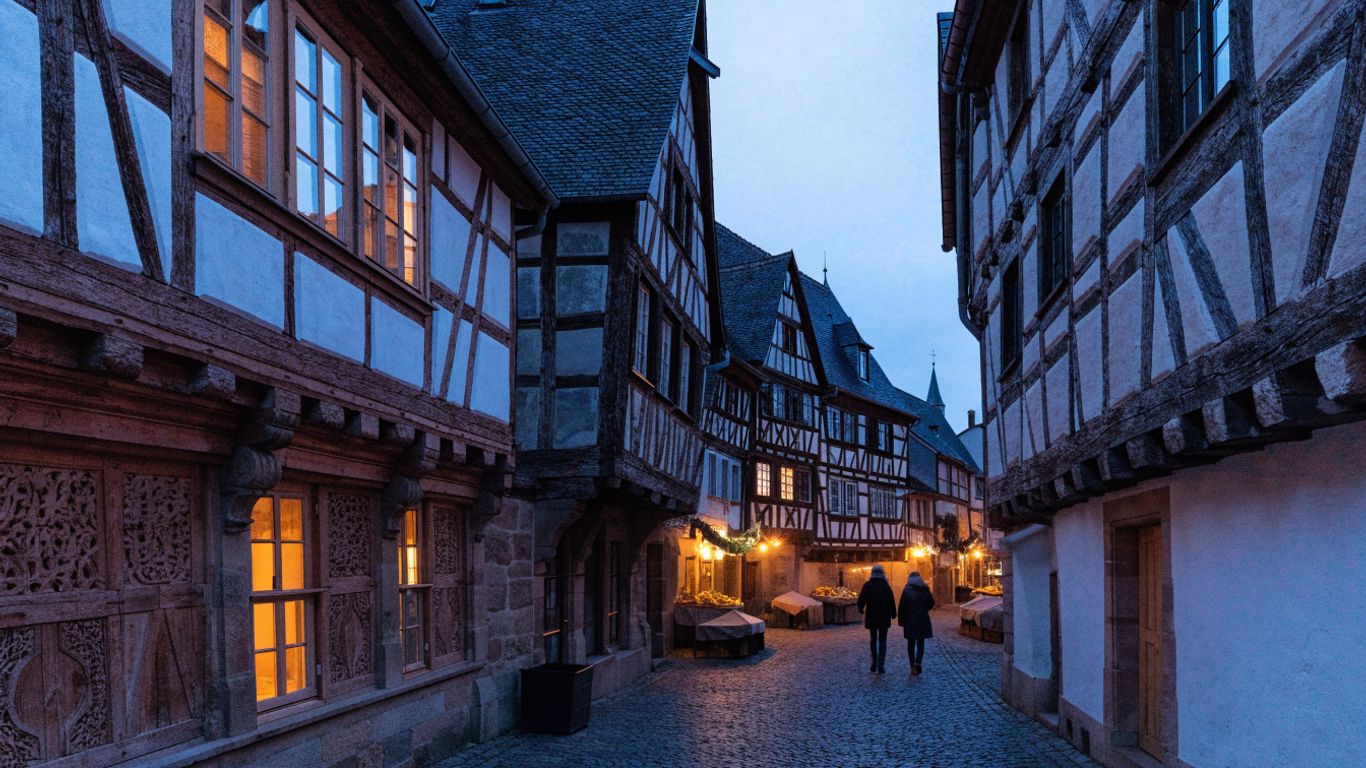 Riquewihr’s illuminated half-timbered lanes at dusk