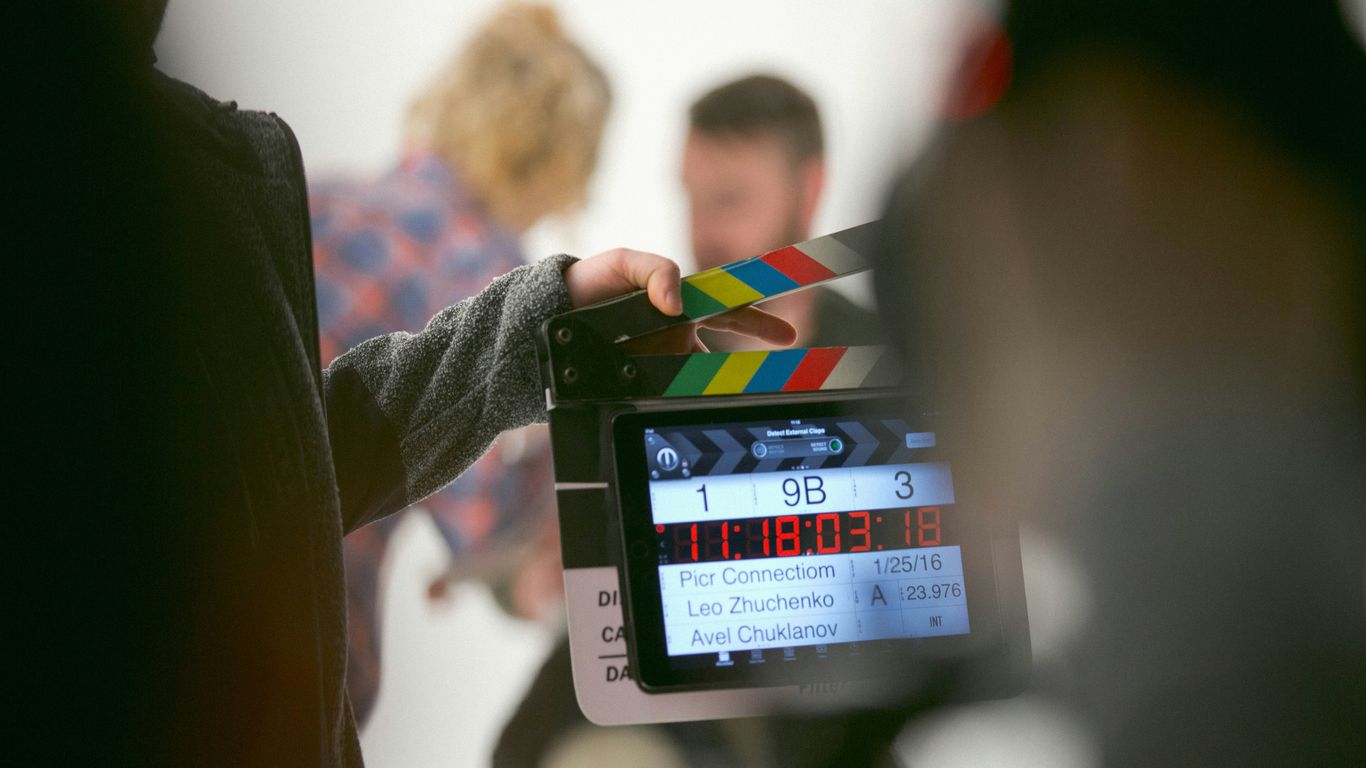 Professional production team filming in a bright Miami workspace