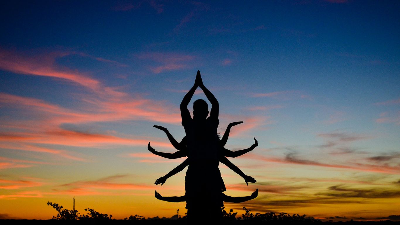 silhouette of person jumping during sunset