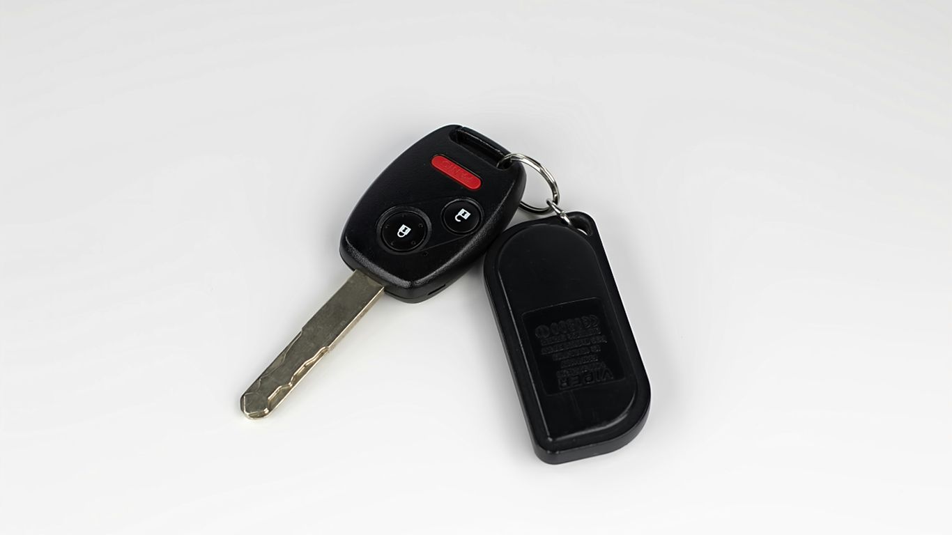 Car keys and smart fob beside vehicle