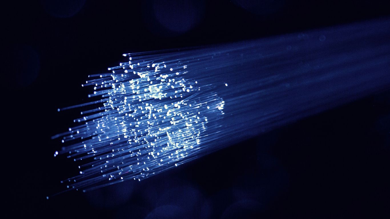 Light beams interacting with an optical circuit chip.