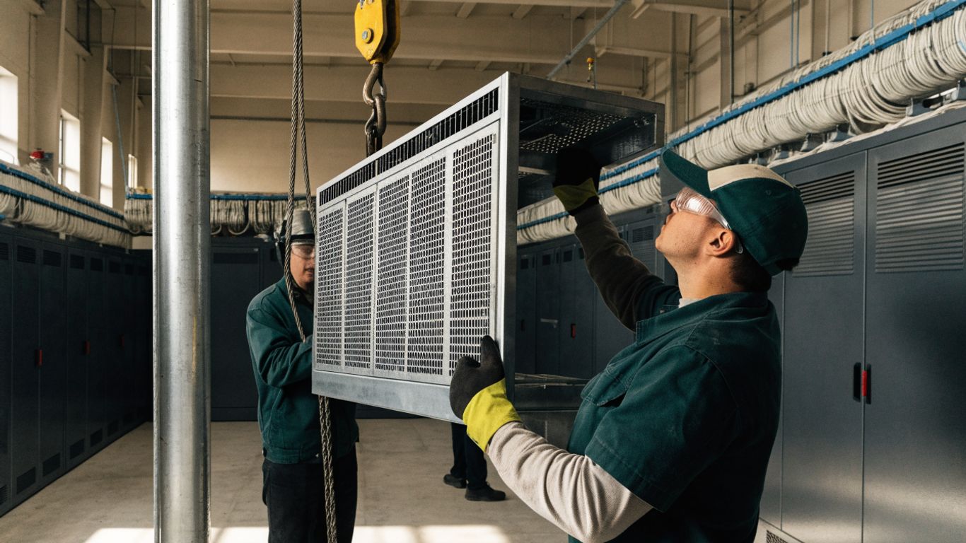 Technicians preparing battery racks for replacement