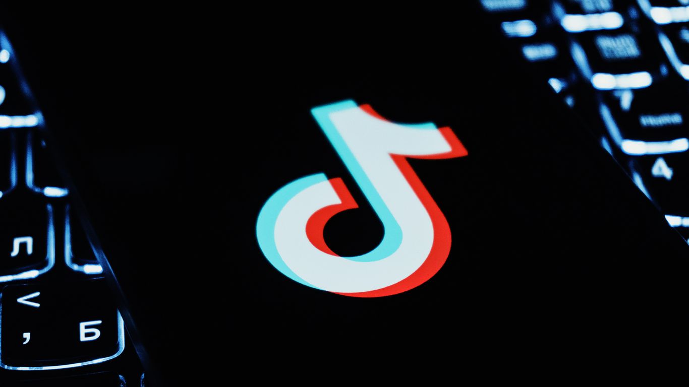 Tiktok logo on a dark keyboard background