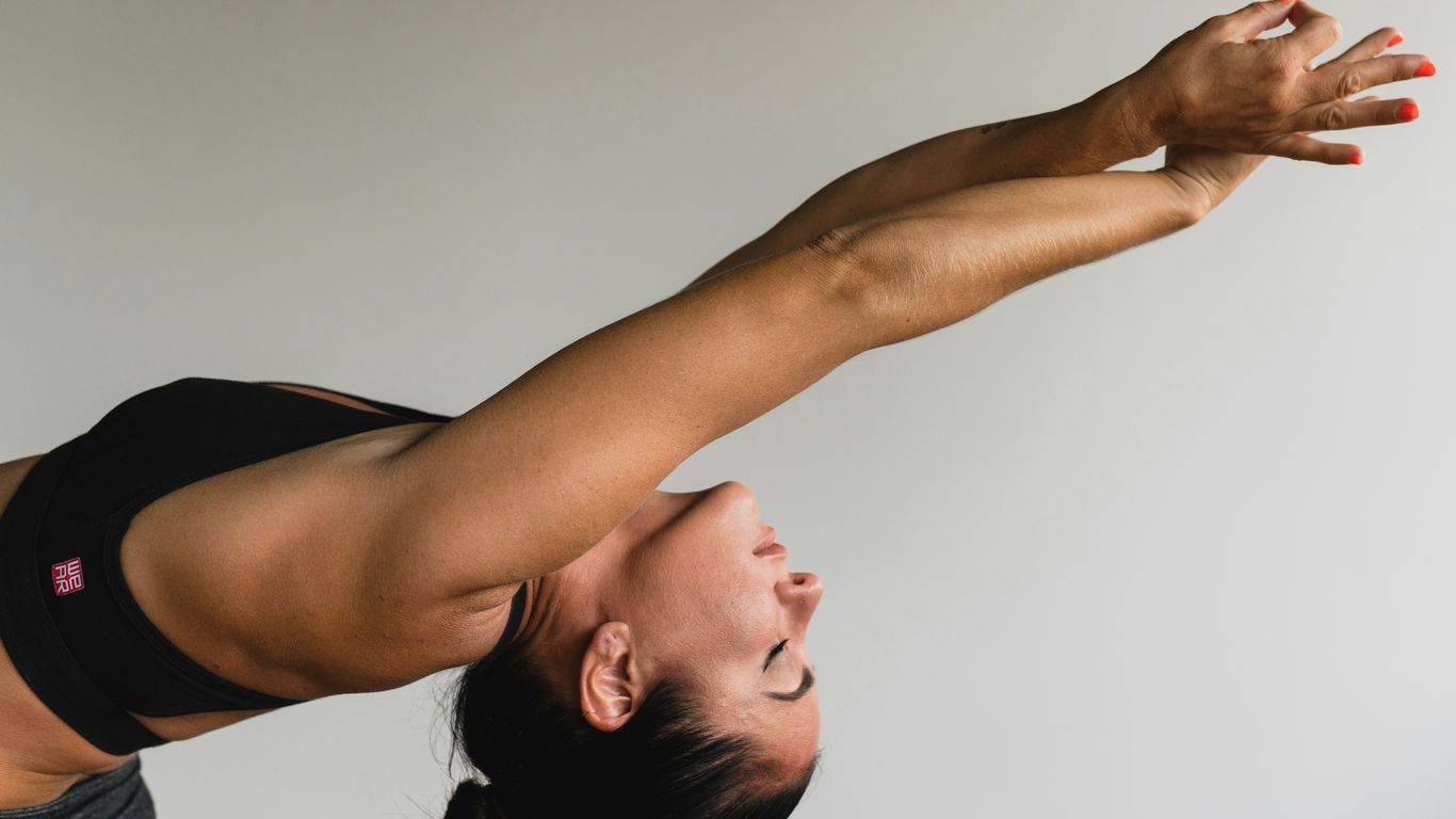 Shoulders warming up with yoga strap