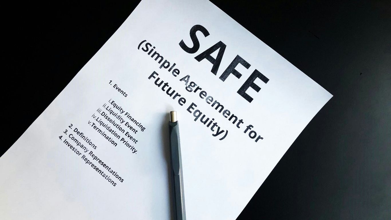 a pen sitting on top of a piece of paper