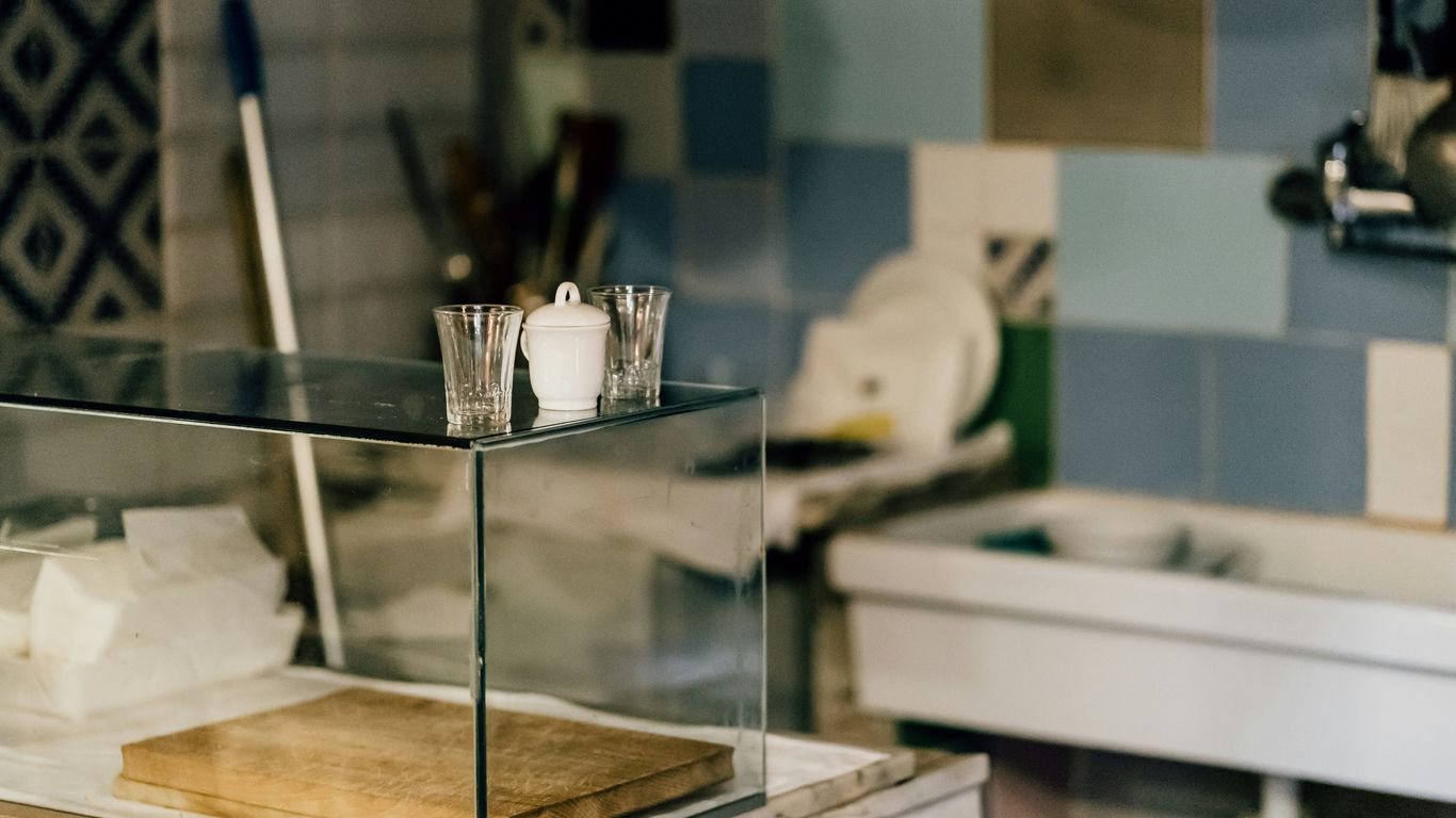 clear glass container on glass table