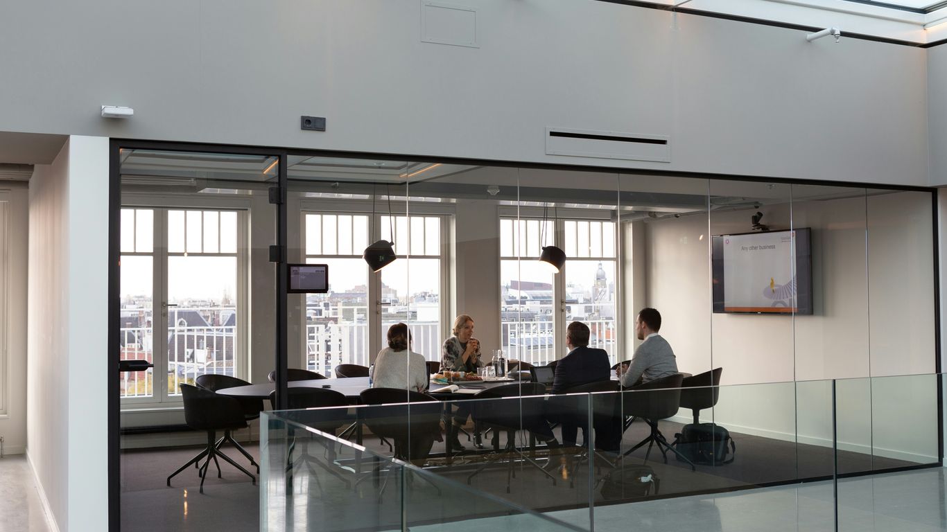 Professional office reception signage displayed on white wall
