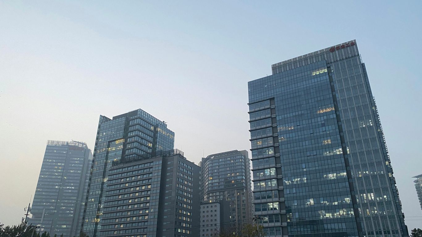 Modern glass skyscrapers against a clear sky