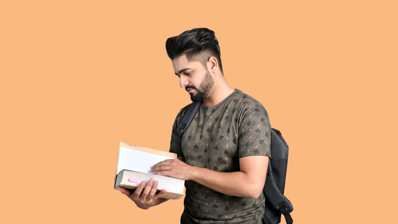 a man holding a book