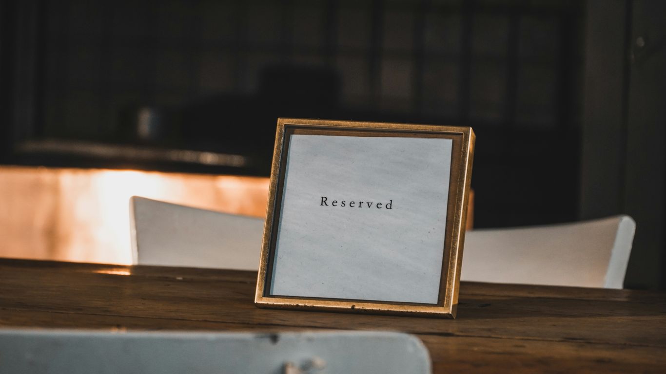 Double-sided sign stands placed on a glass cabinet