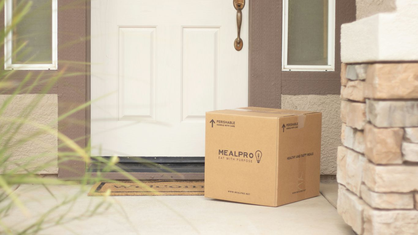 Courier preparing a parcel for handover