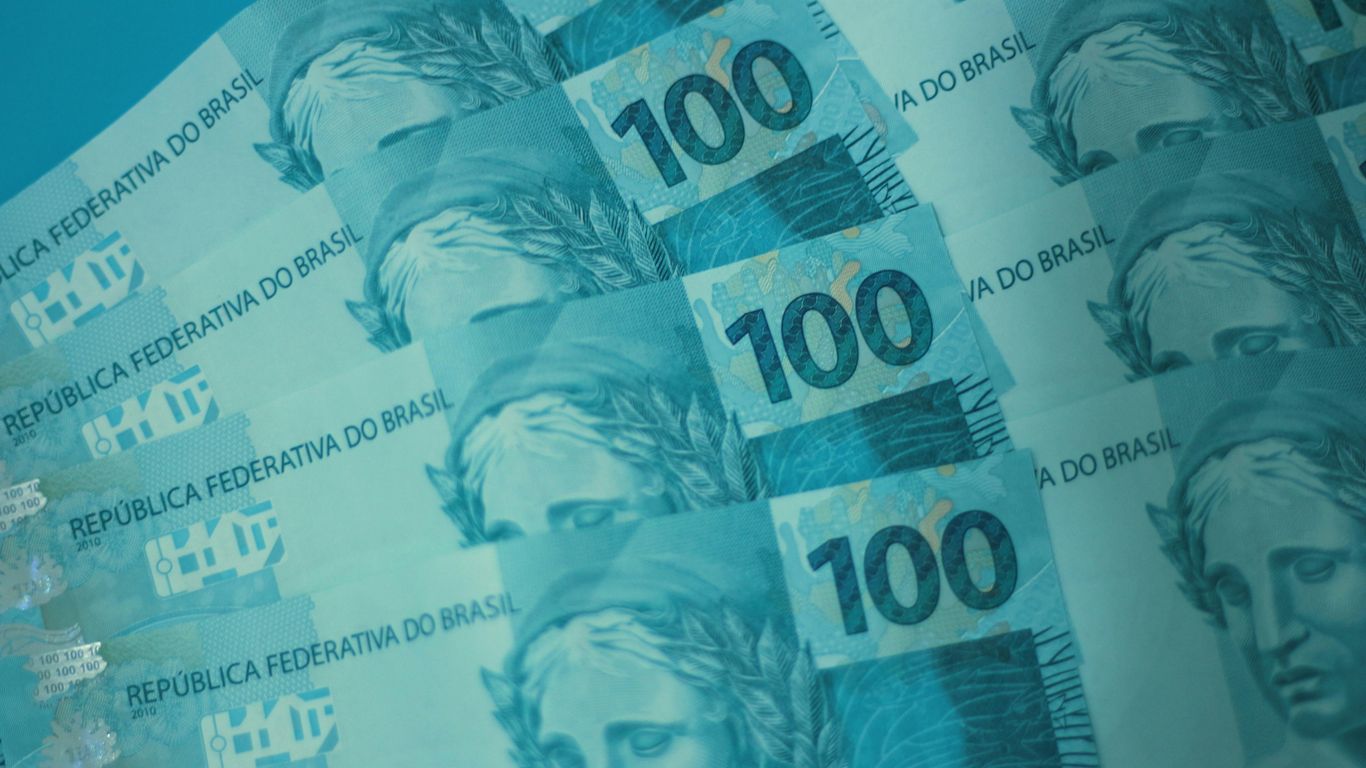 A bunch of money sitting on top of each other