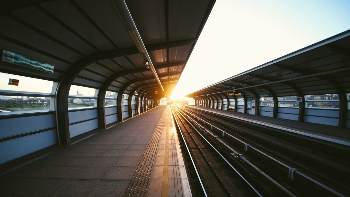Passengers waiting beside Singapore railway platforms