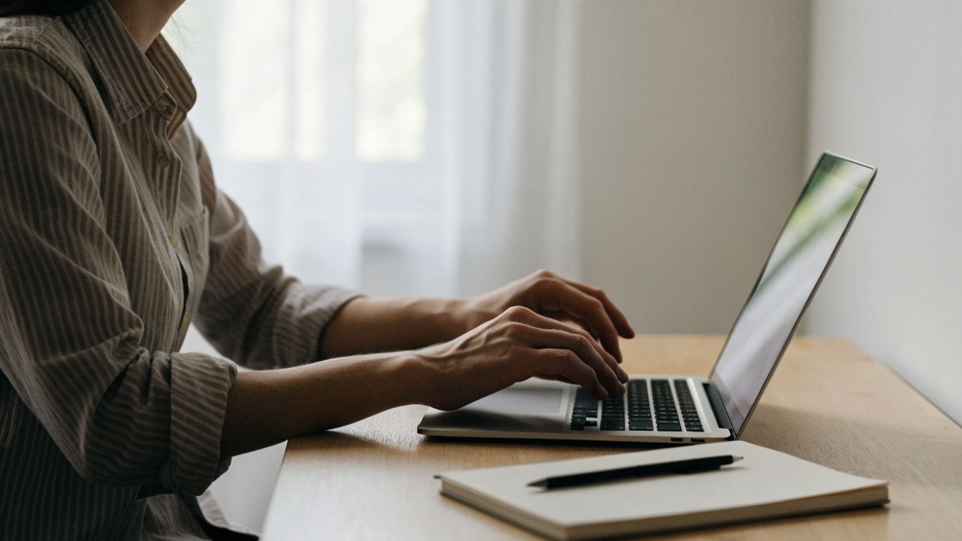 Trader checking a secure website on laptop