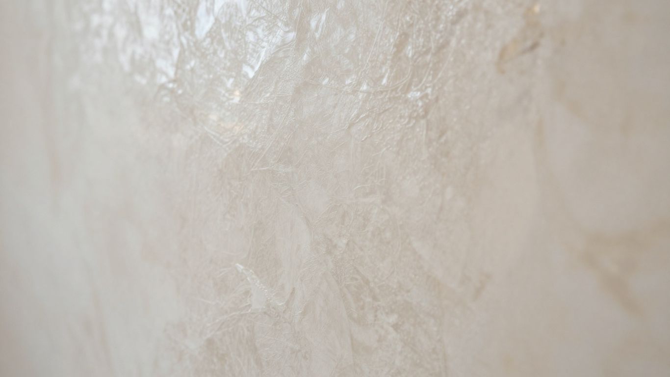 Wall with smooth, polished Venetian plaster finish.