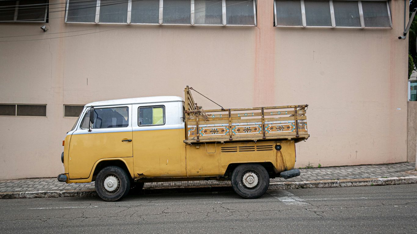 a yellow van with a trailer