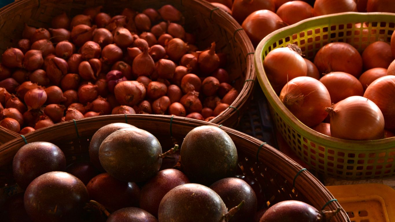 Vendors displaying fresh produce at a market