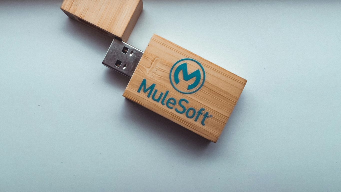 a wooden usb stick with a logo on it