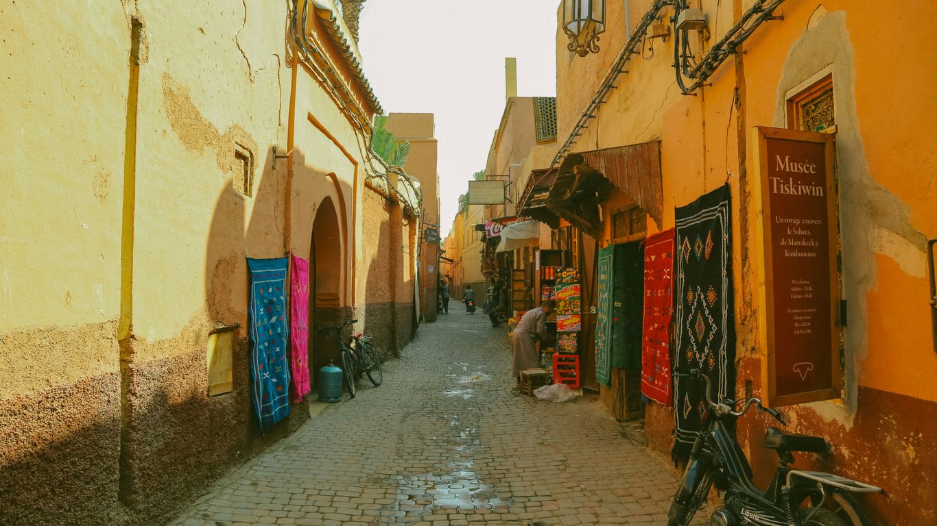 A narrow road lined with historic houses
