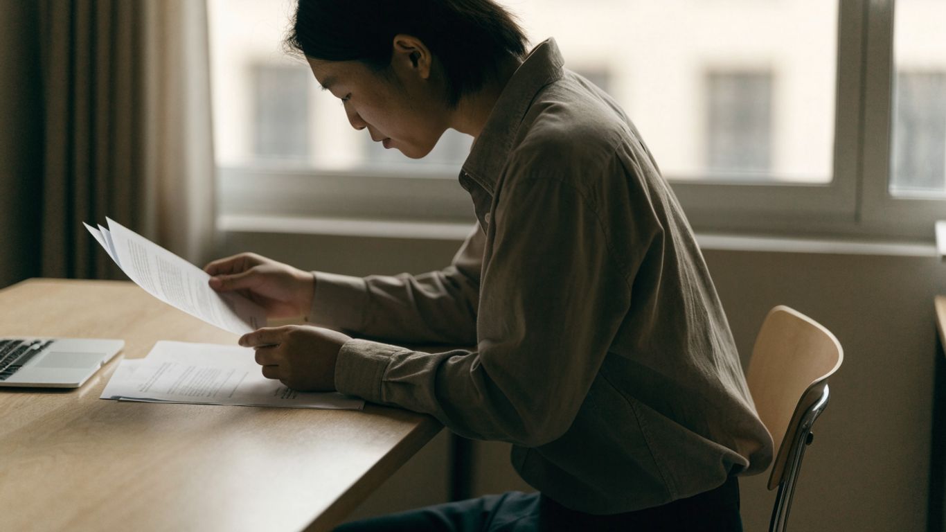 Trader reviewing account terms at a desk