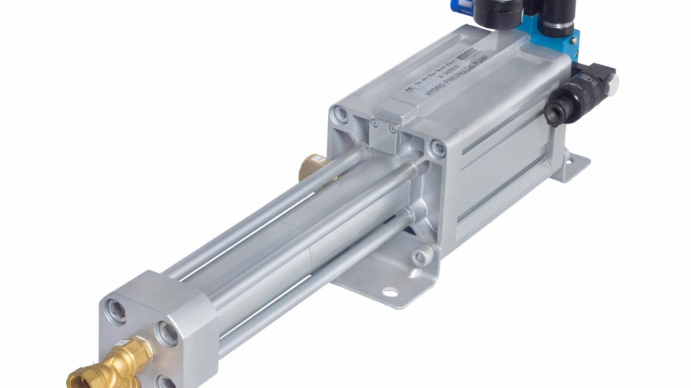 An industrial pneumatic cylinder with gauges.