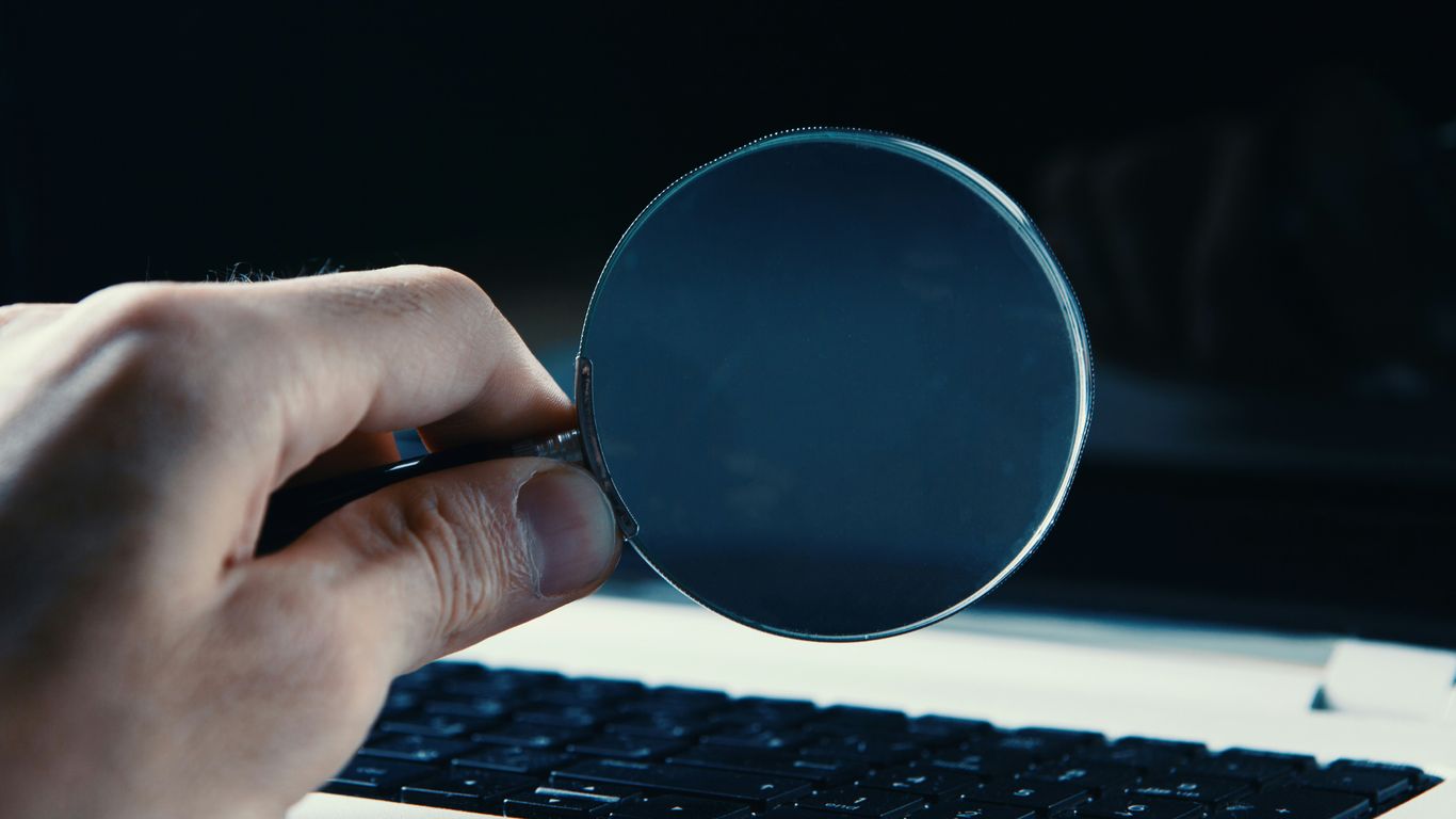 person holding round blue frame