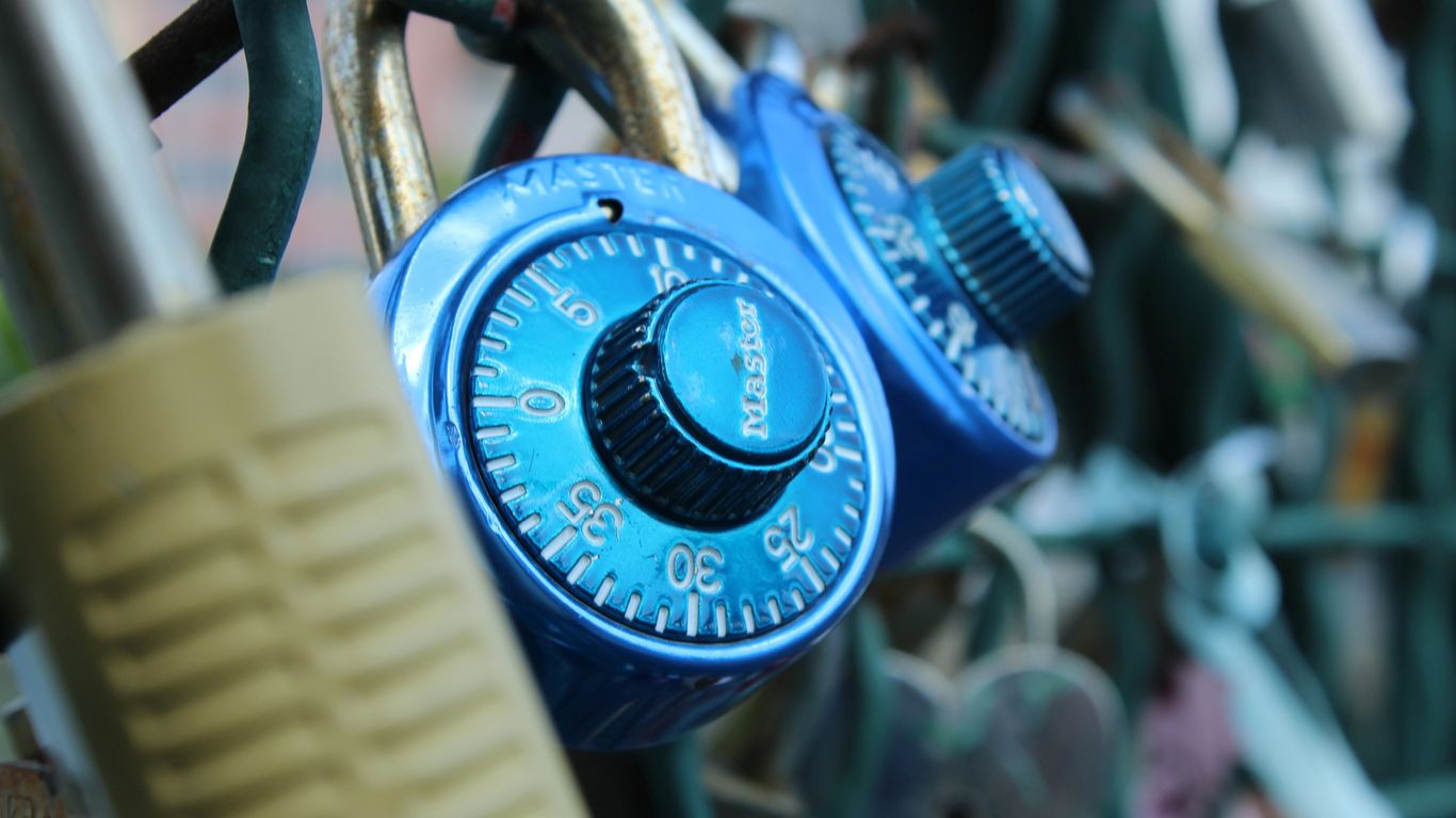 a combination combination lock attached to a fence