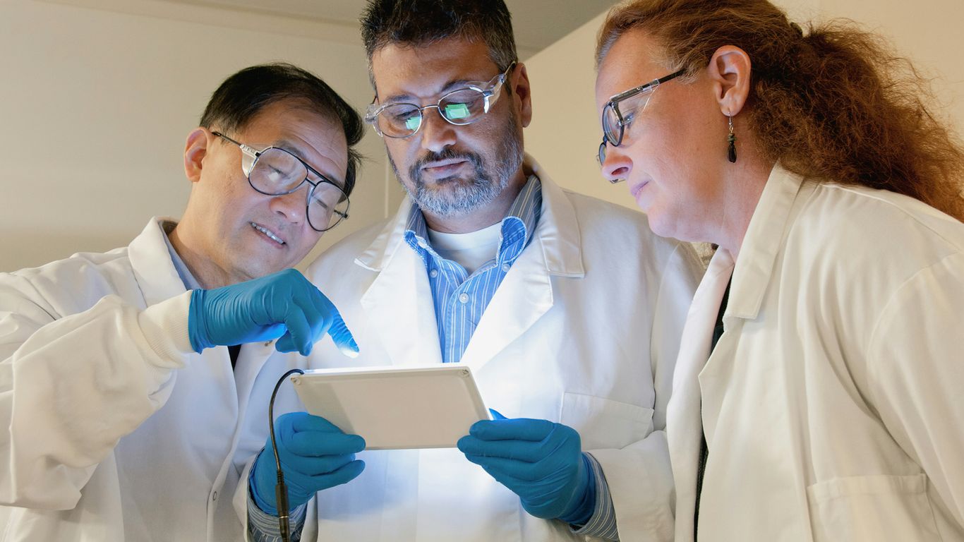 Laboratory team reviewing clinical research data
