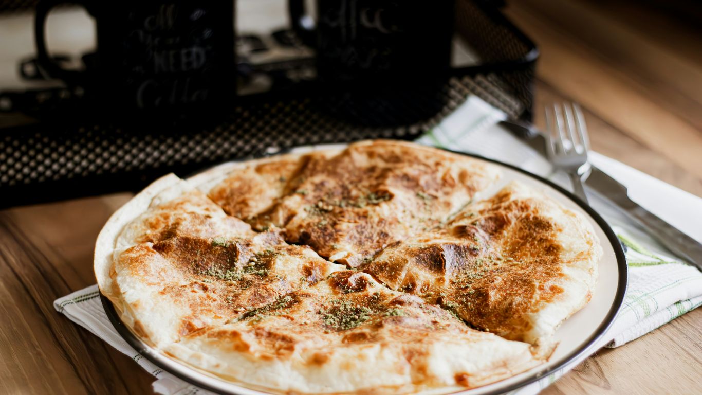 Fresh roti prata on a warm plate