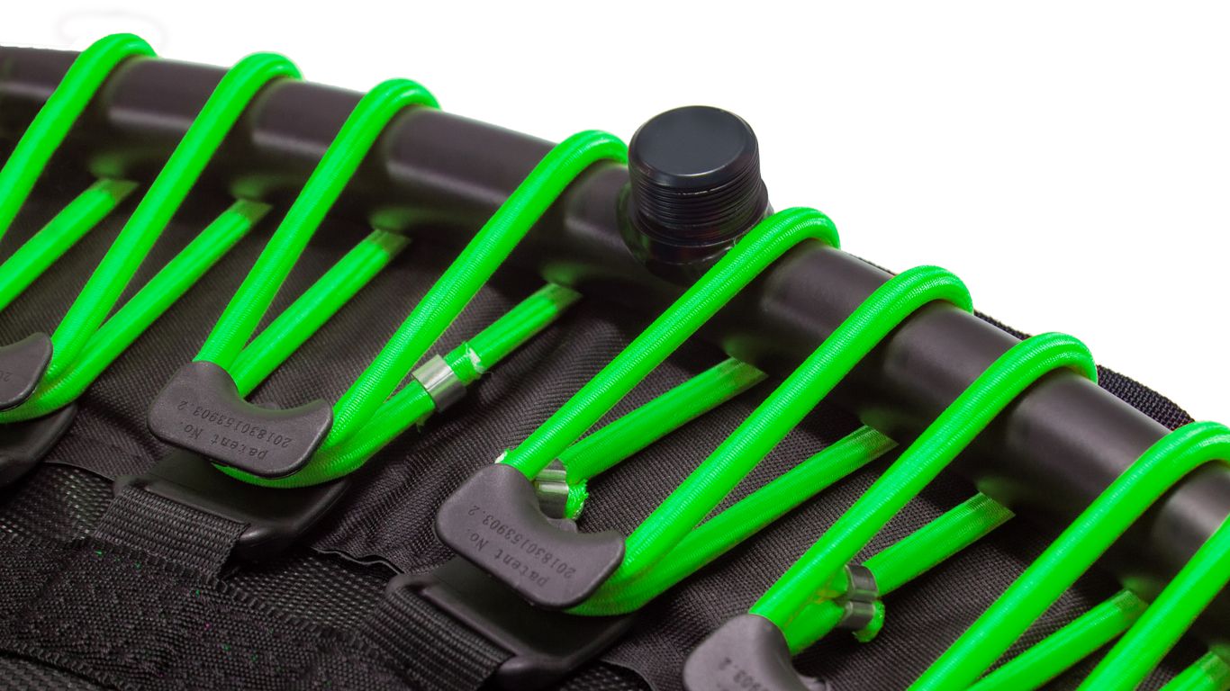 Close-up of green bungee cords attached to black circular frame.