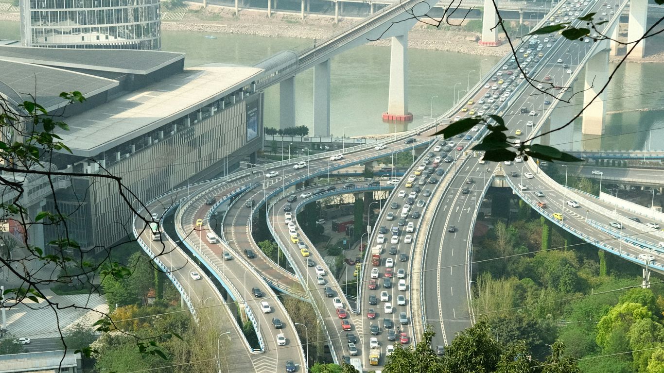 a view of a highway with a bridge in the background