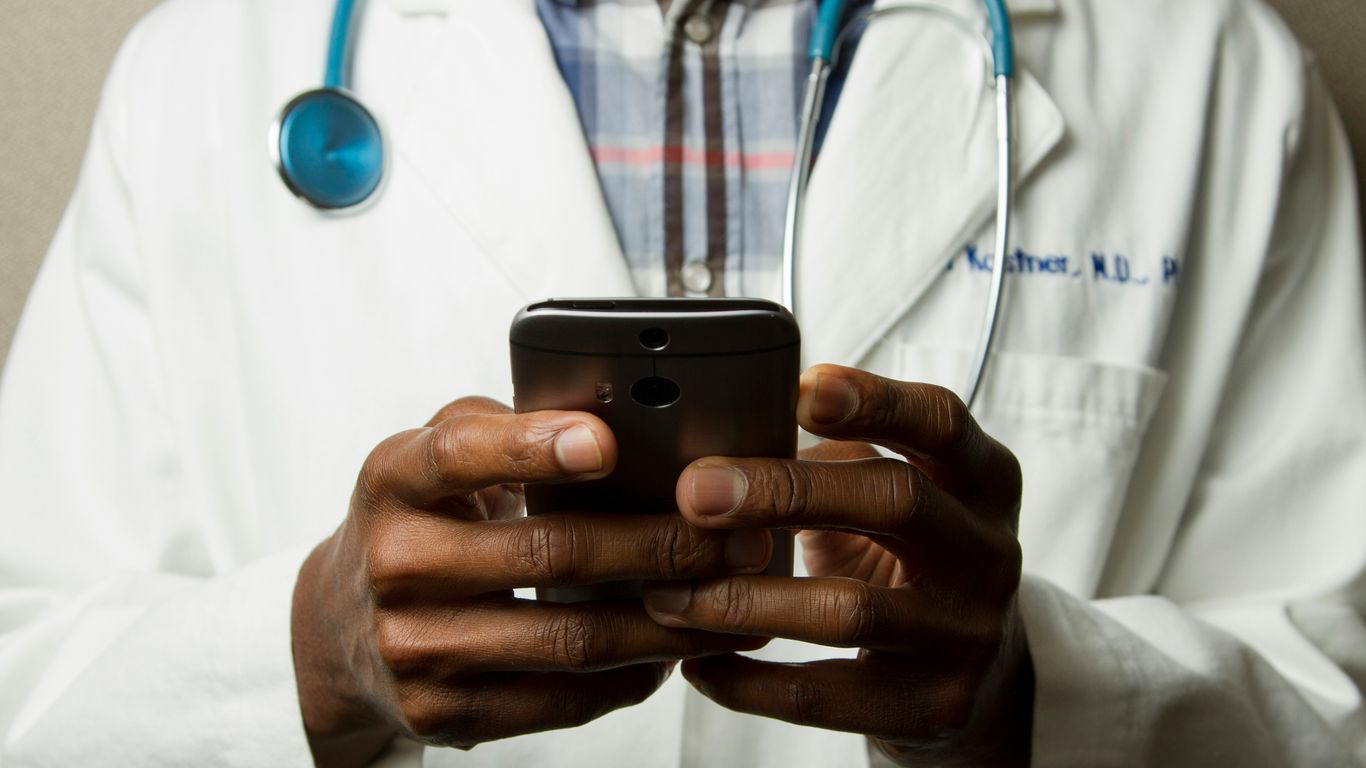 A smartphone showing social media icons for health