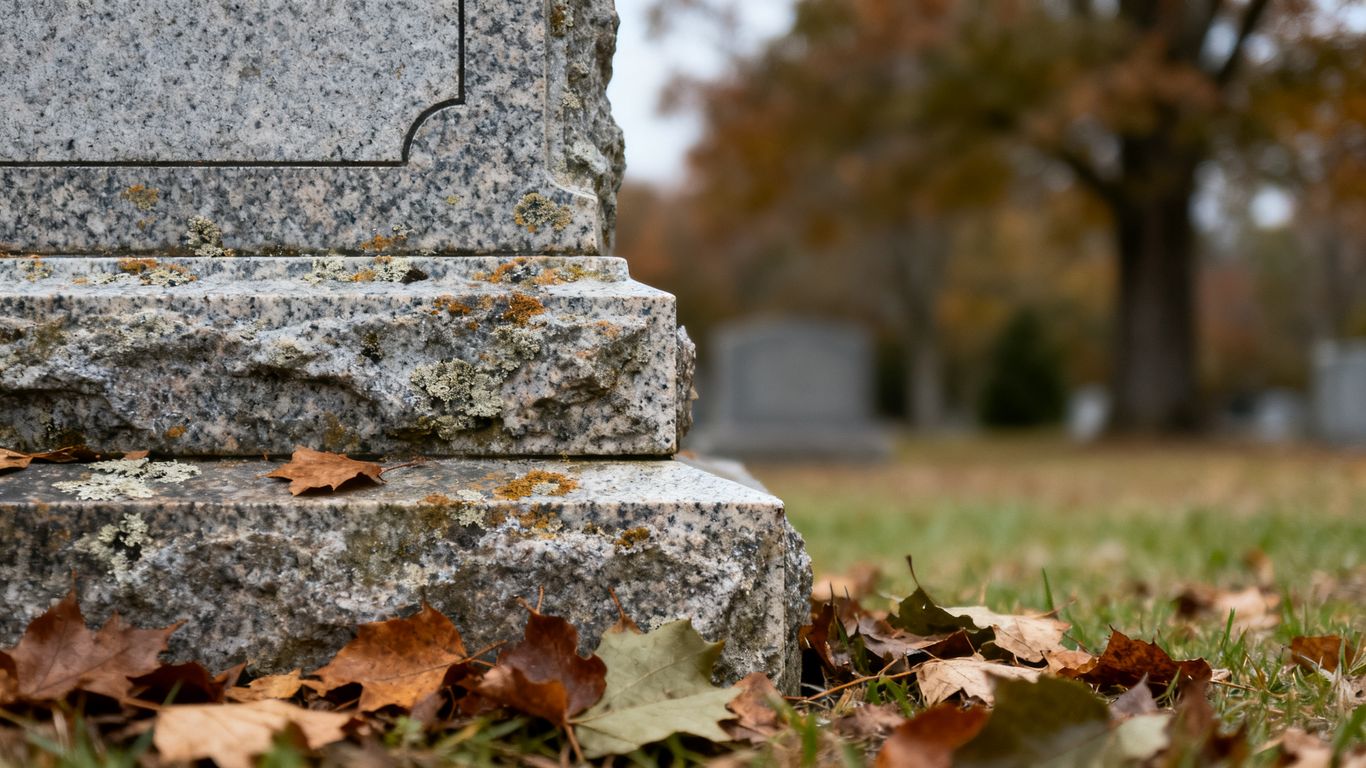 Weathered granite memorial with gentle patina