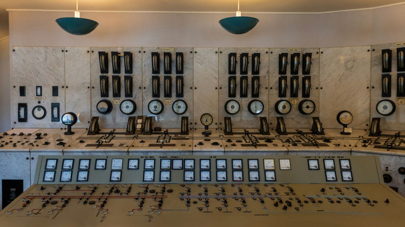 A large control room with lots of control knobs