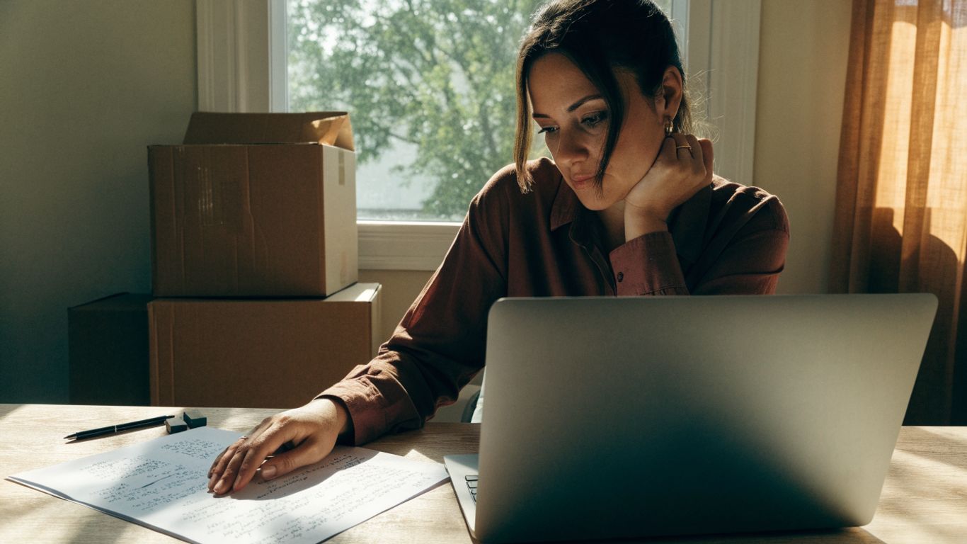 Employee preparing notes before a video meeting