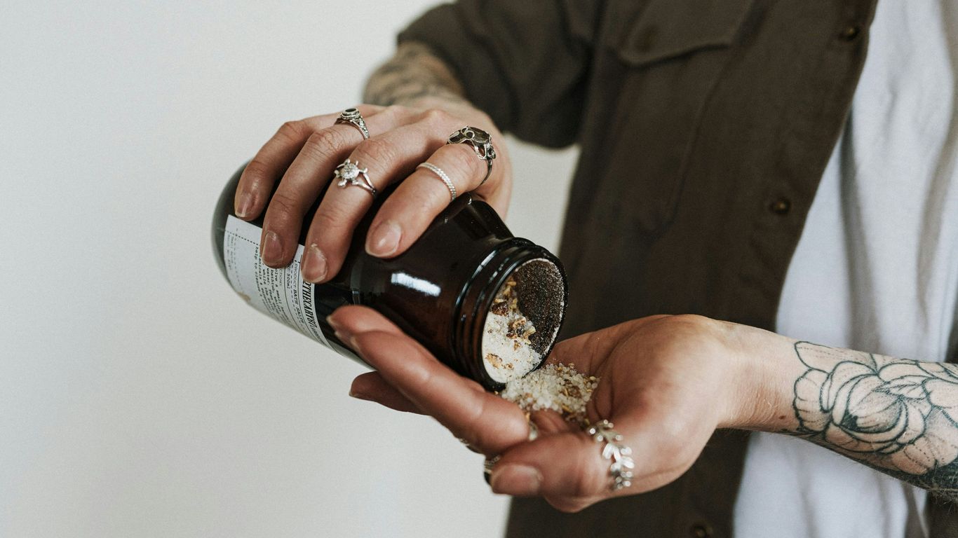 person holding black ceramic mug