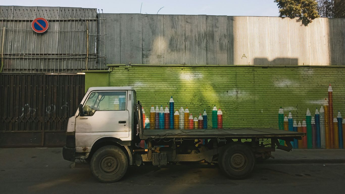 white and blue truck on road during daytime