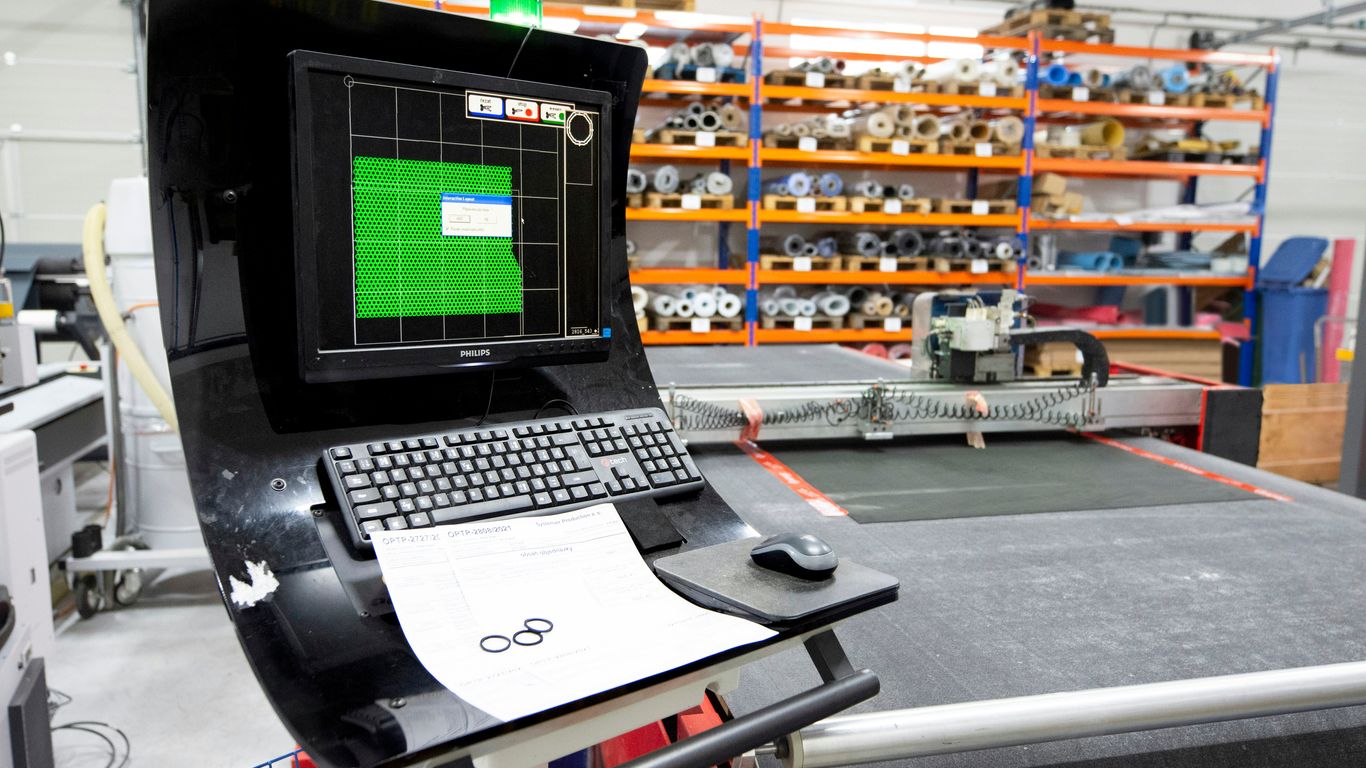a laptop computer sitting on top of a table