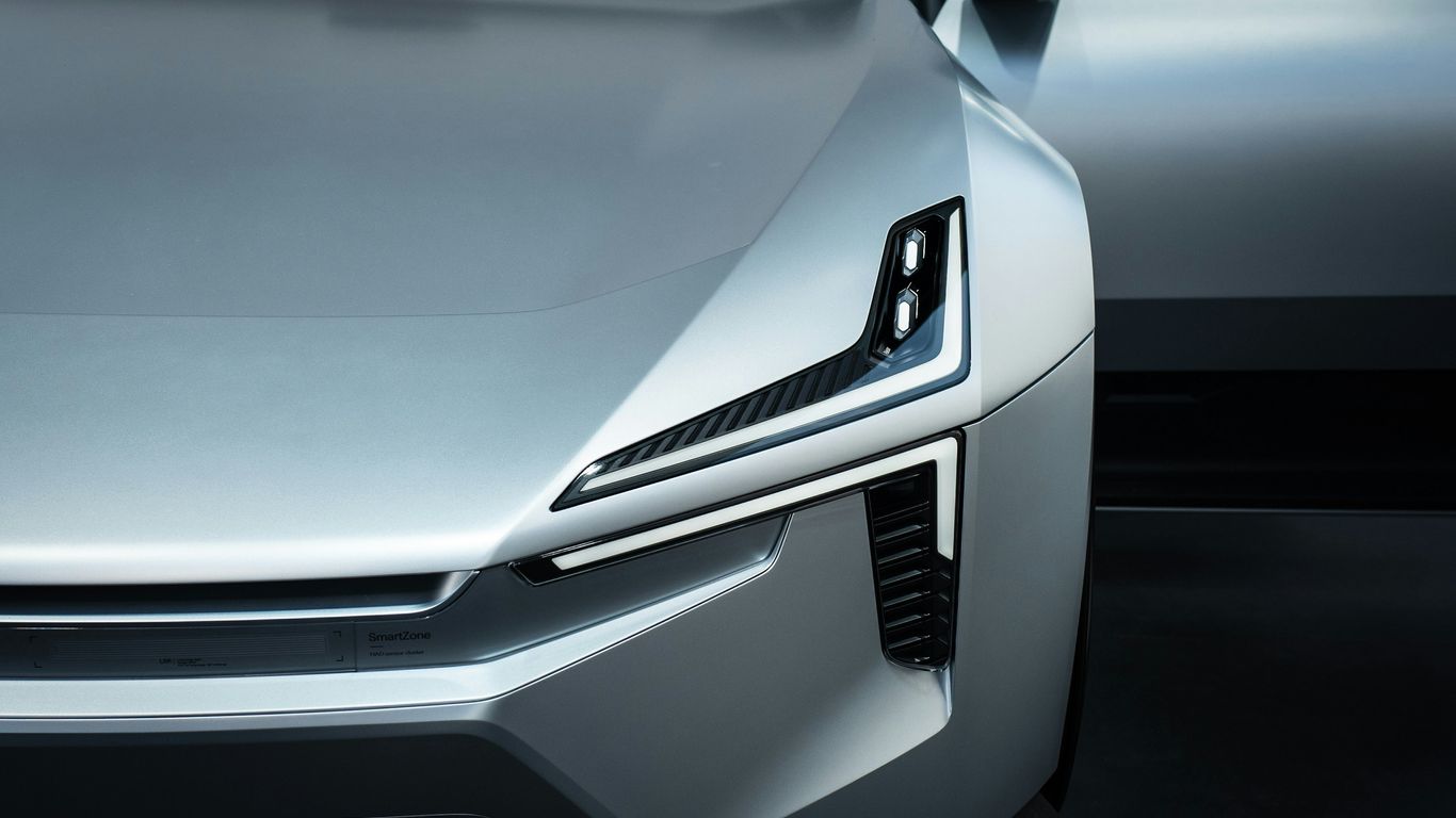 a close up of the front of a silver car