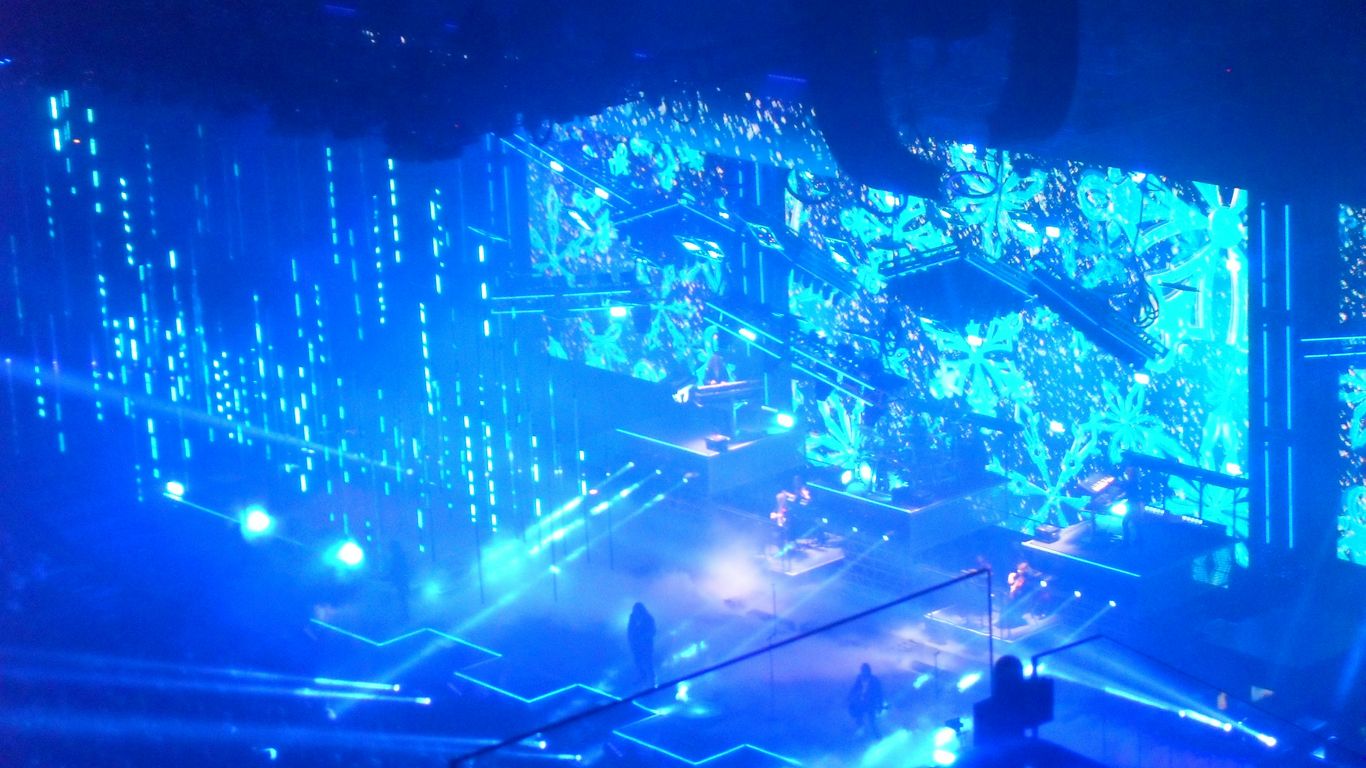 Stage with blue lights and digital patterns