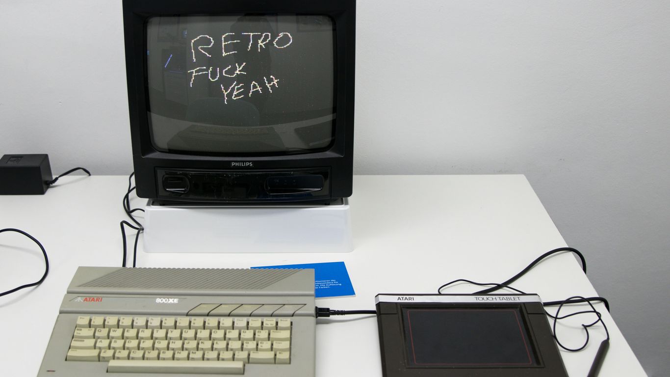 black crt tv beside white computer keyboard