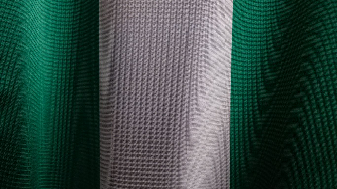 a close up of a green and white curtain
