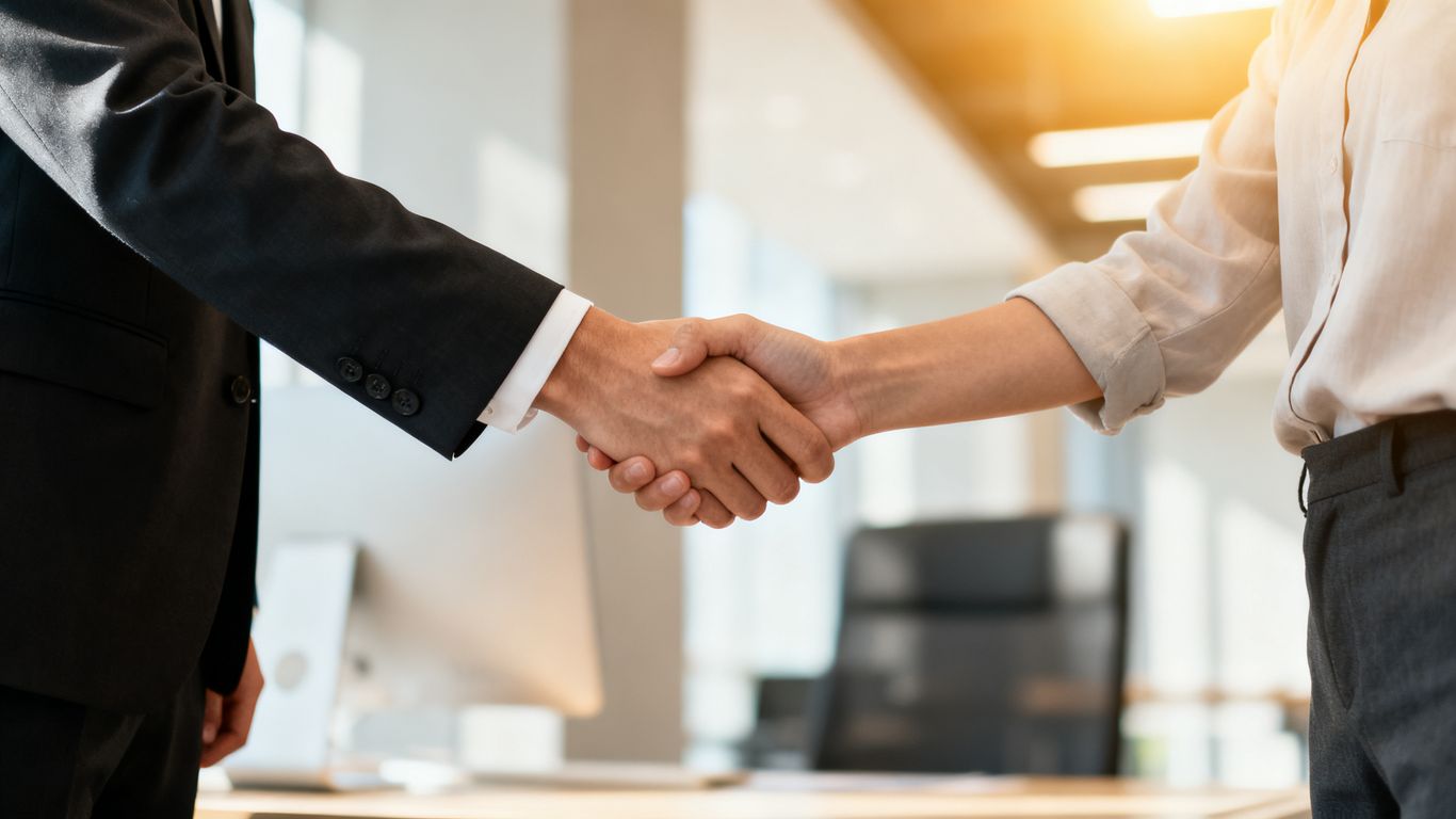 Business handshake for new hire or promotion announcement.