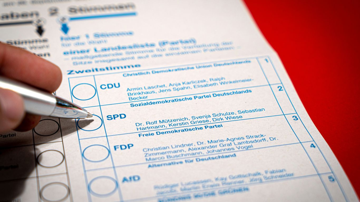 a person is filling out a form with a pen