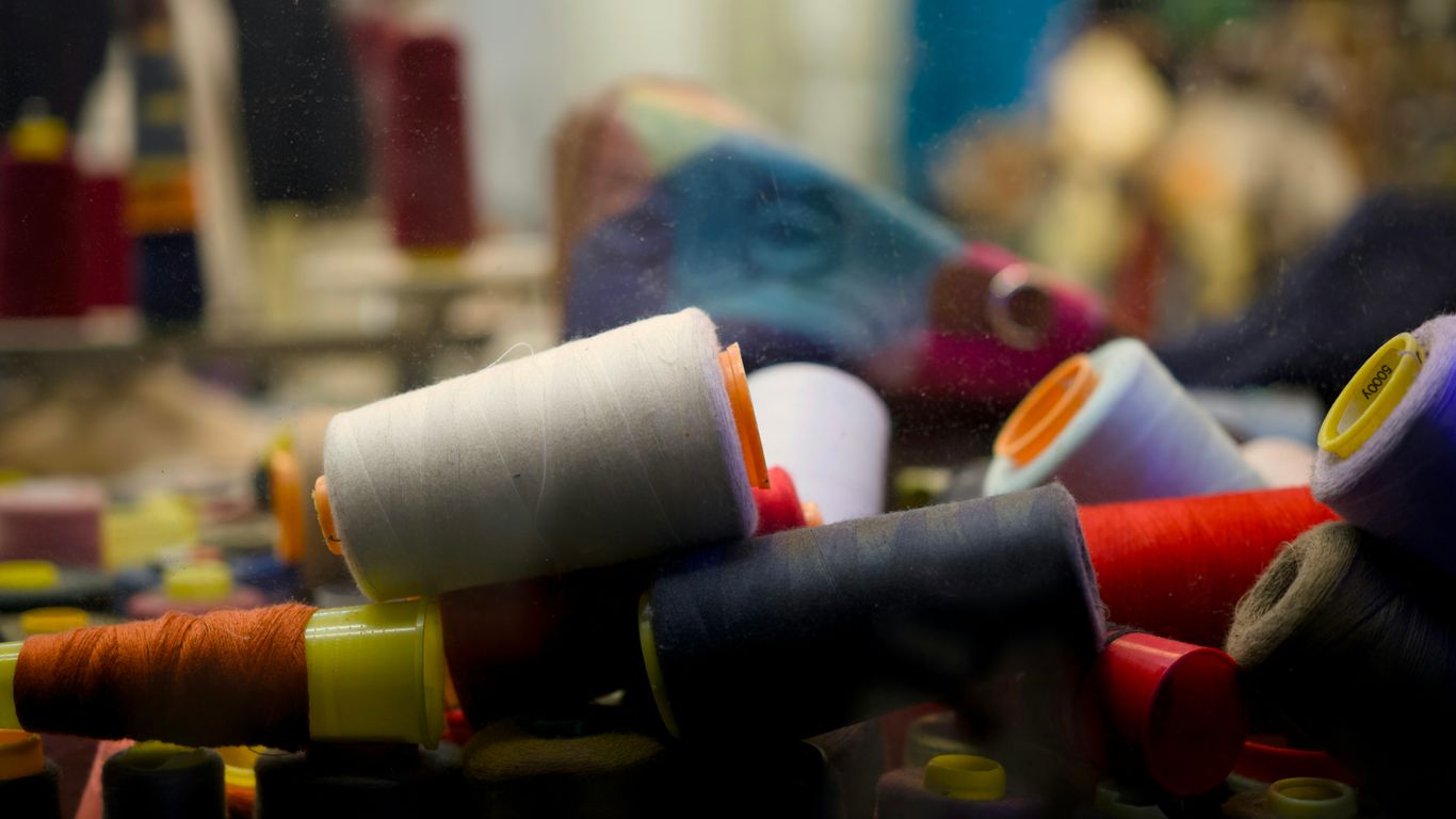 Colourful textiles displayed along Arab Street shophouses